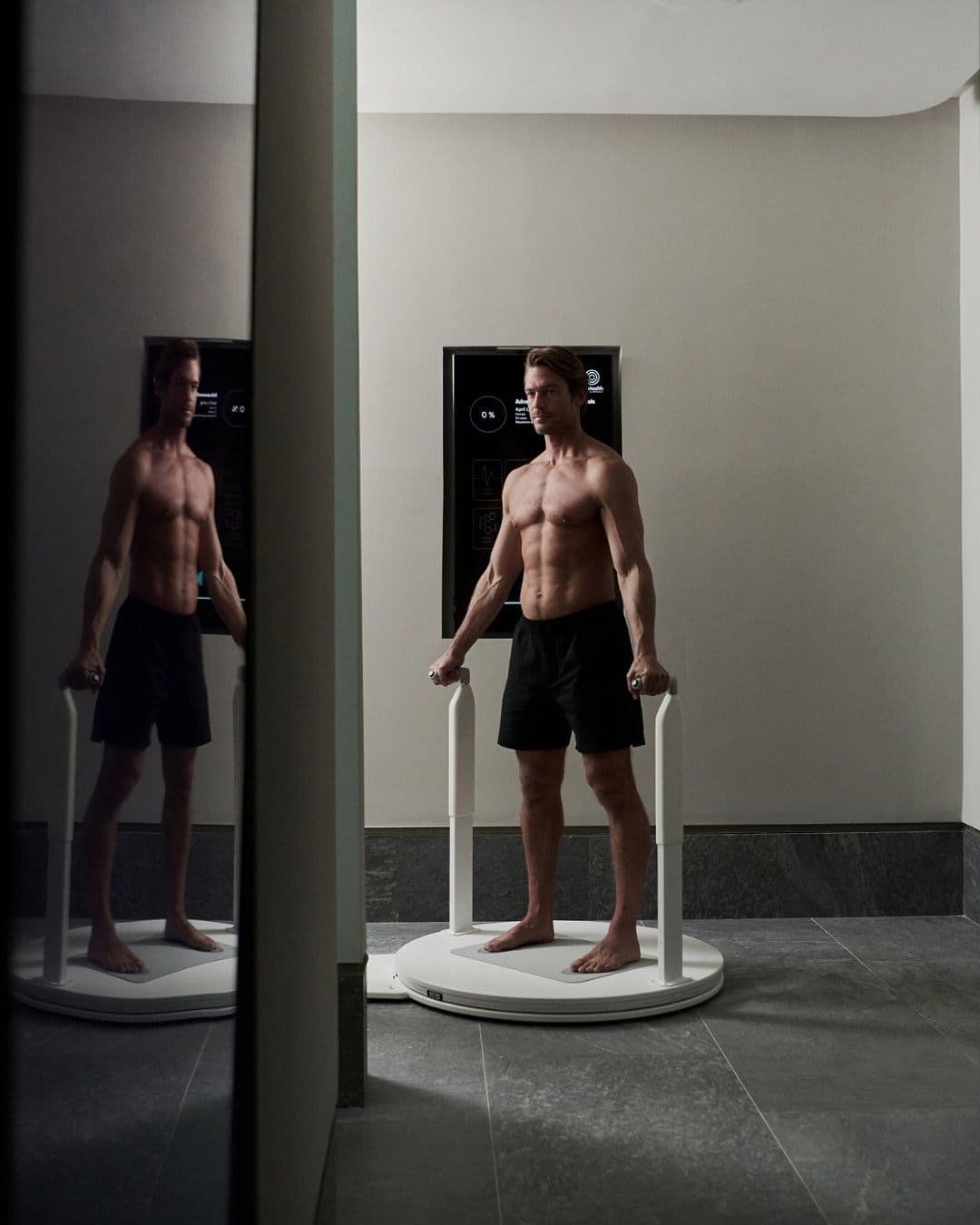 A patient on a body-composition scanner with on-screen analytics — the kind of data digital clinics actually use.