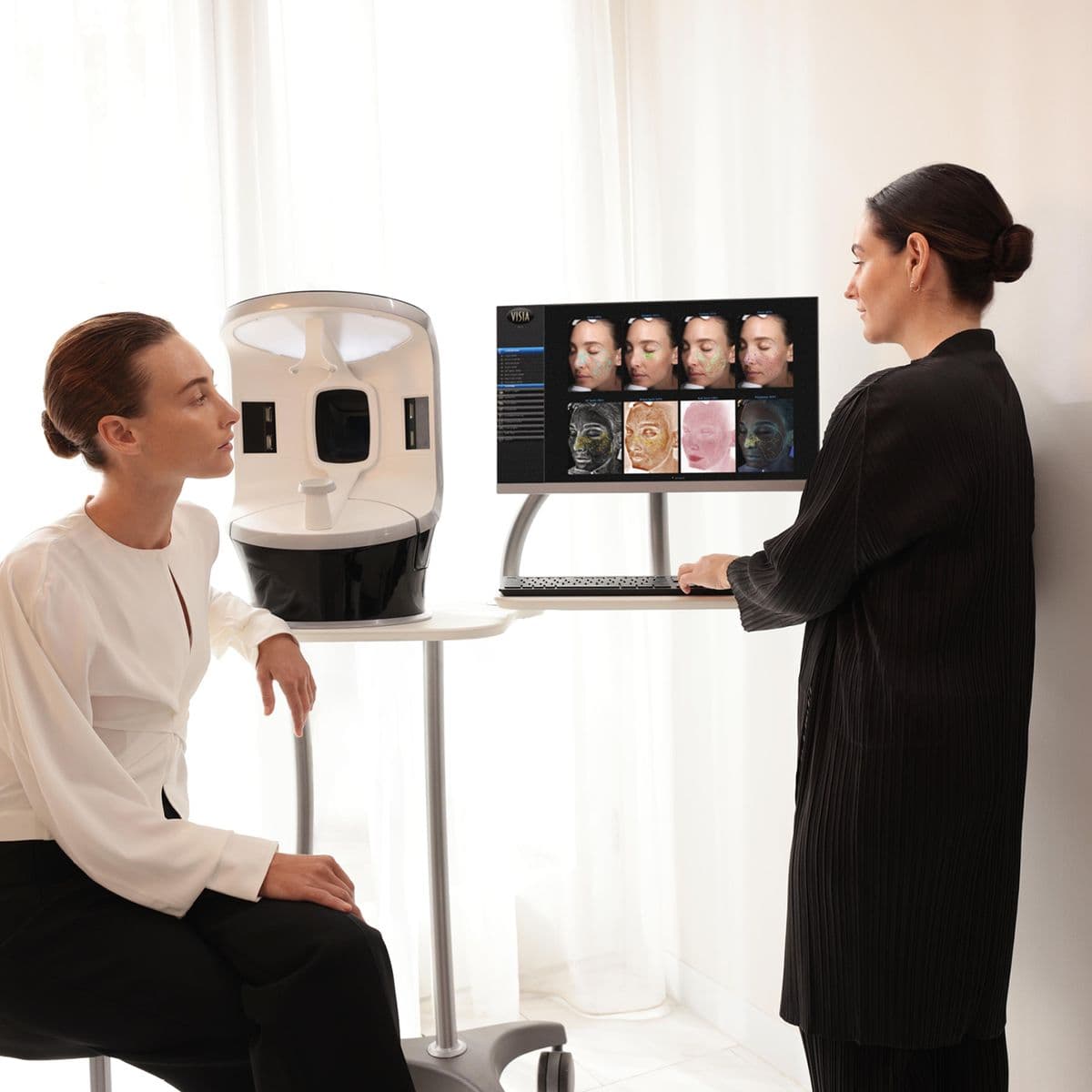 A clinician reviewing a VISIA face-analysis scan with a patient — the standard of care Allura verifies for.